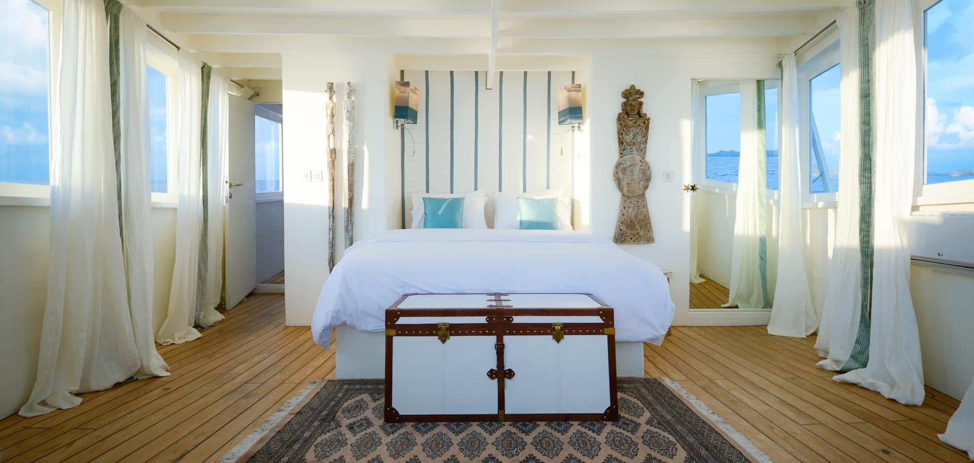 Private master bedroom with a panoramic view inside the luxury superyacht Alexa