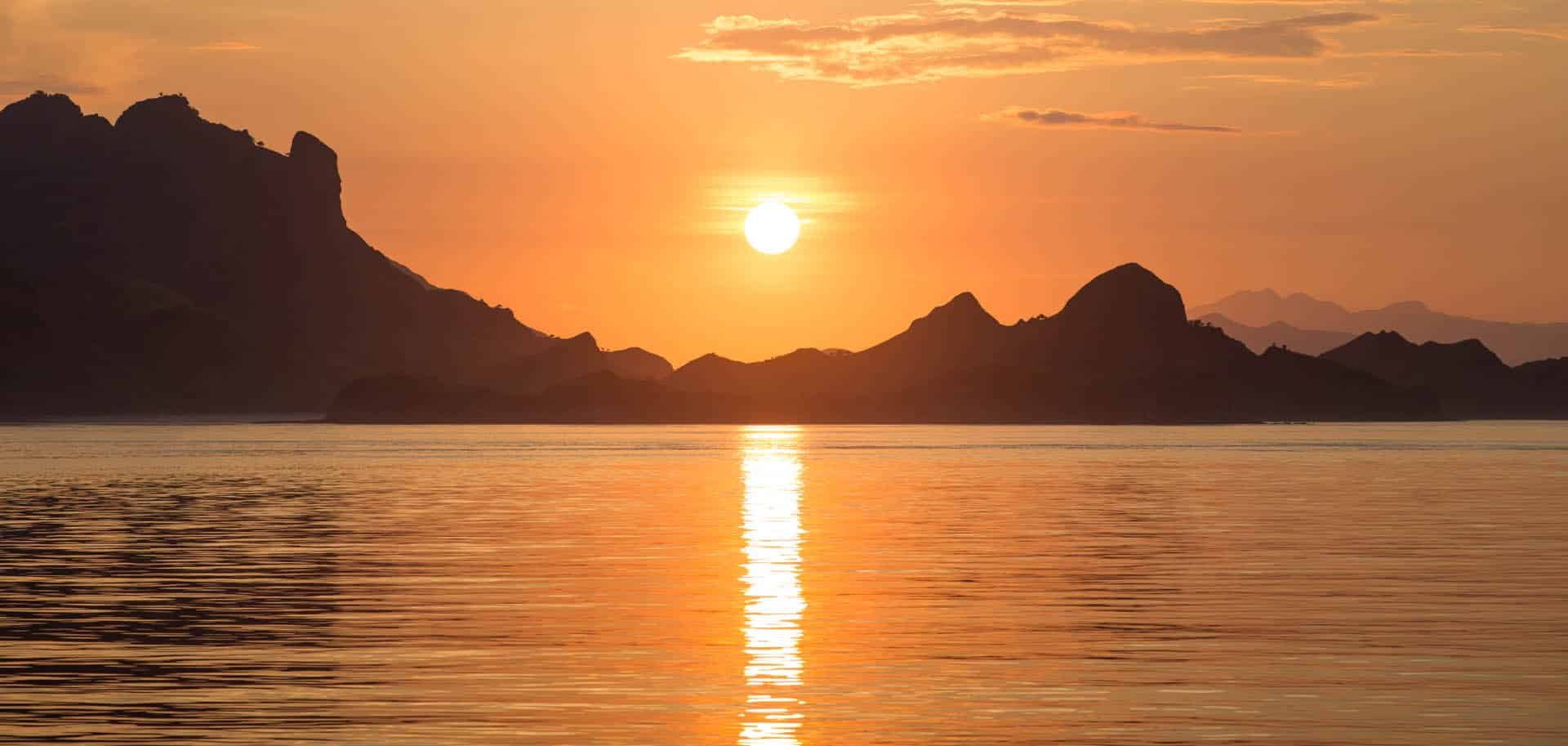 Sun setting over Komodo Islands where Komodo dragons live