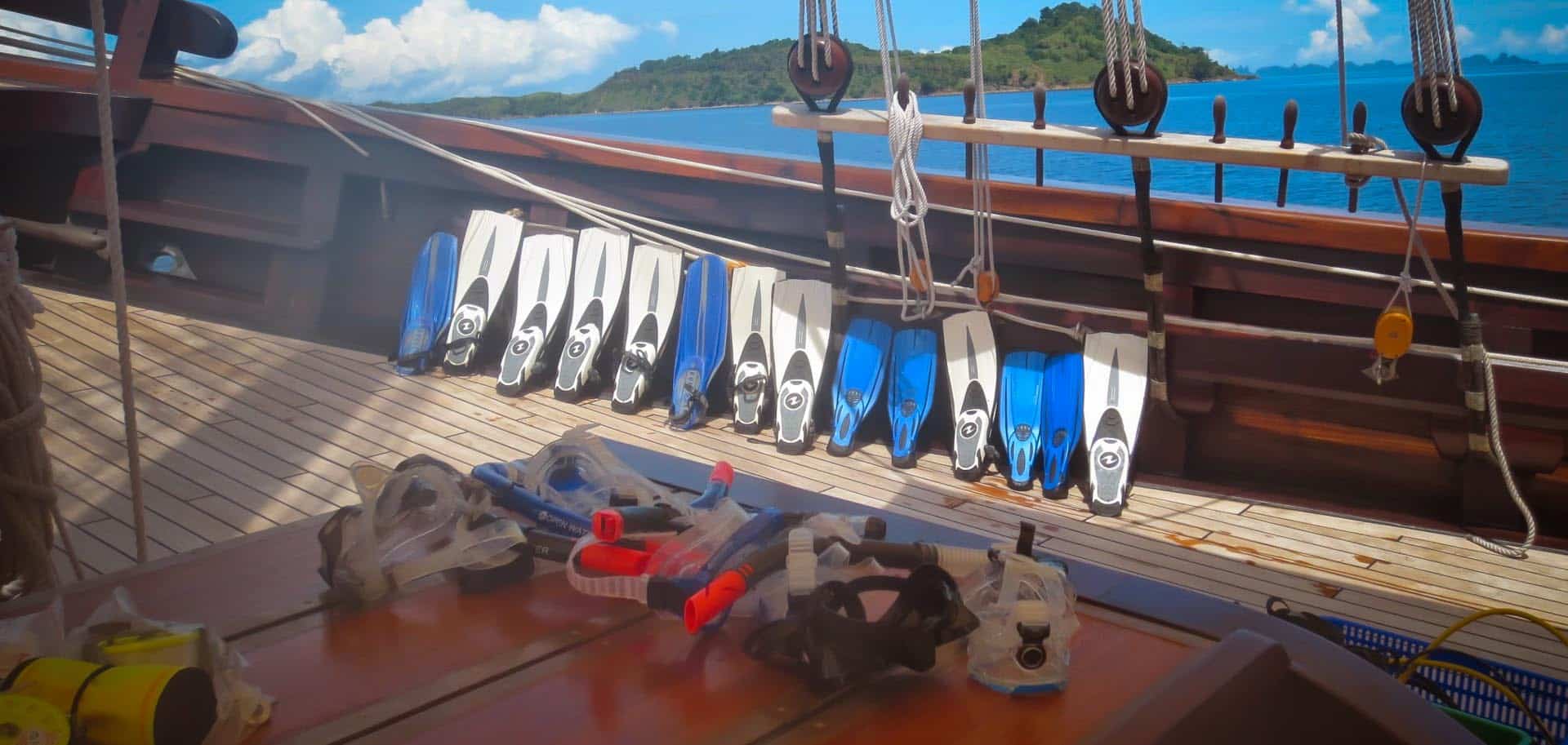 Snorkeling and equipment including fins, masks, and snorkels on board of Dunia Baru