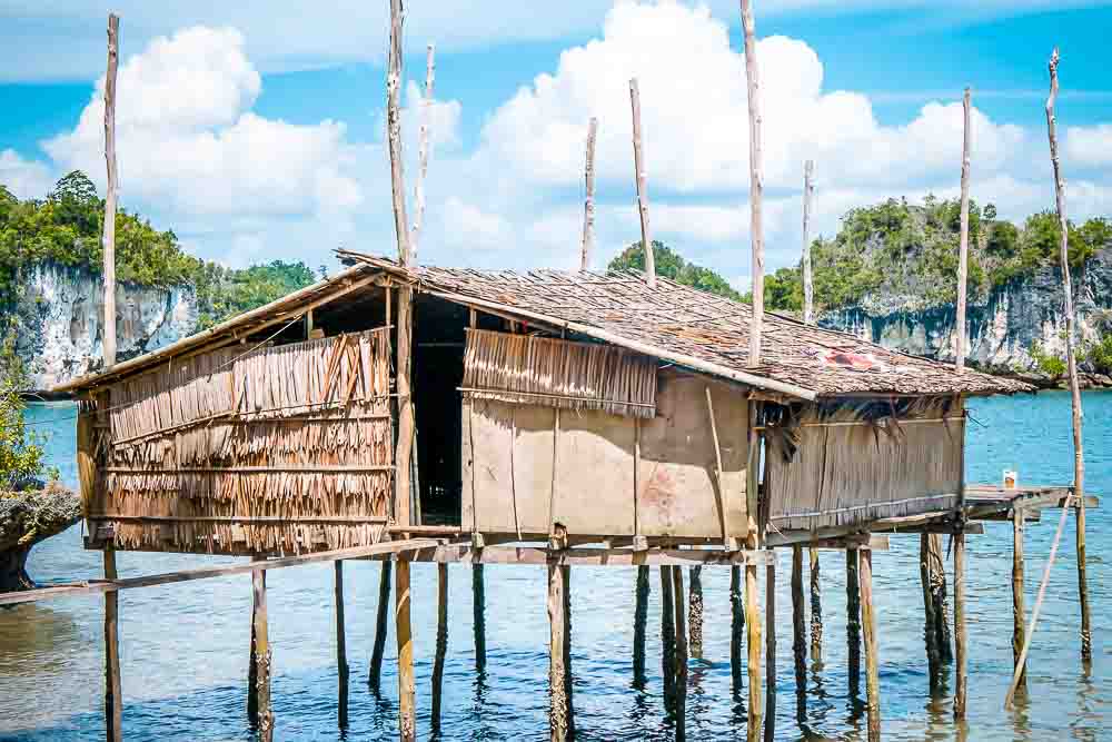 Small wooden fisherman's hut built on water in Boo Islands