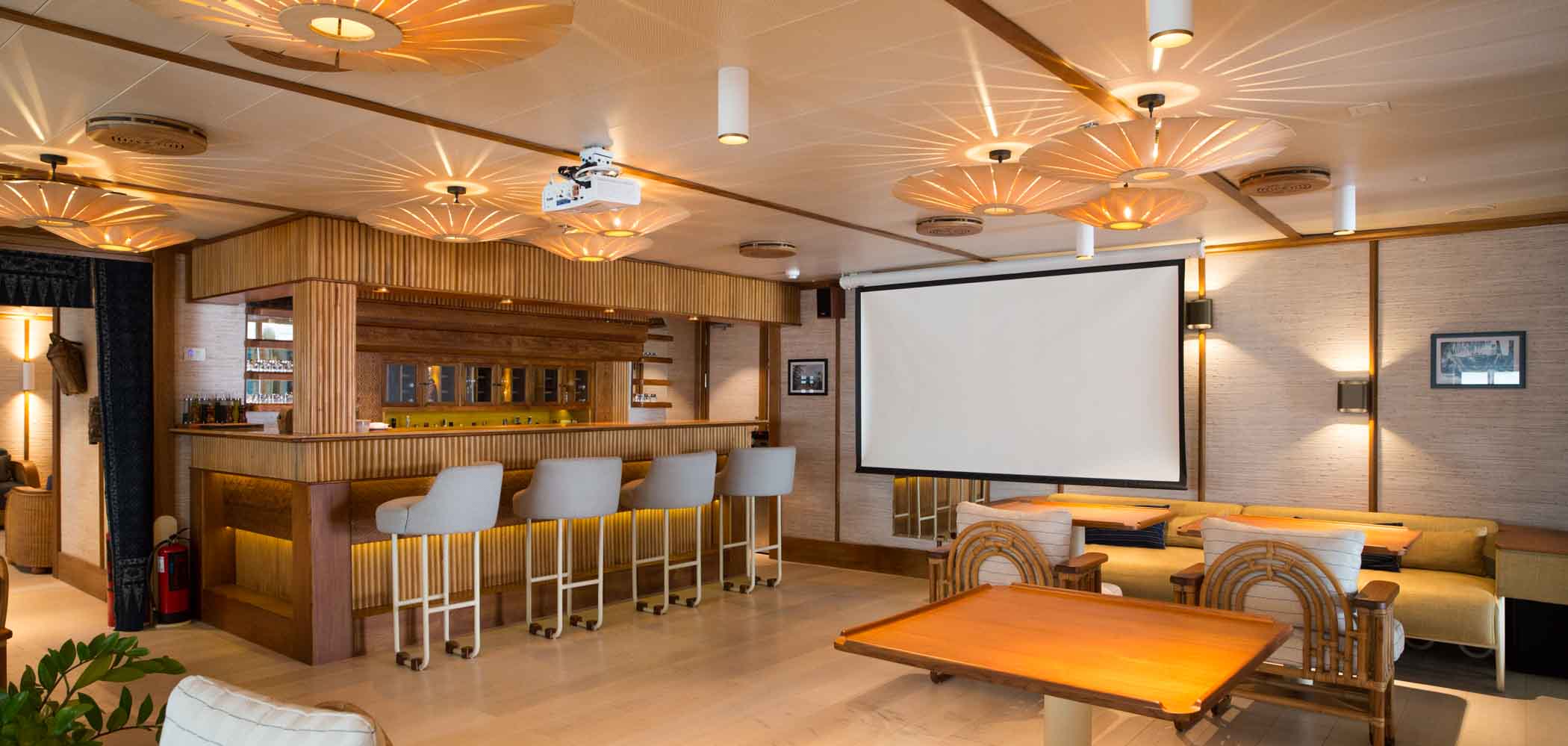Bar area and projection screen for movies and presentations on the Kudanil Explorer superyacht