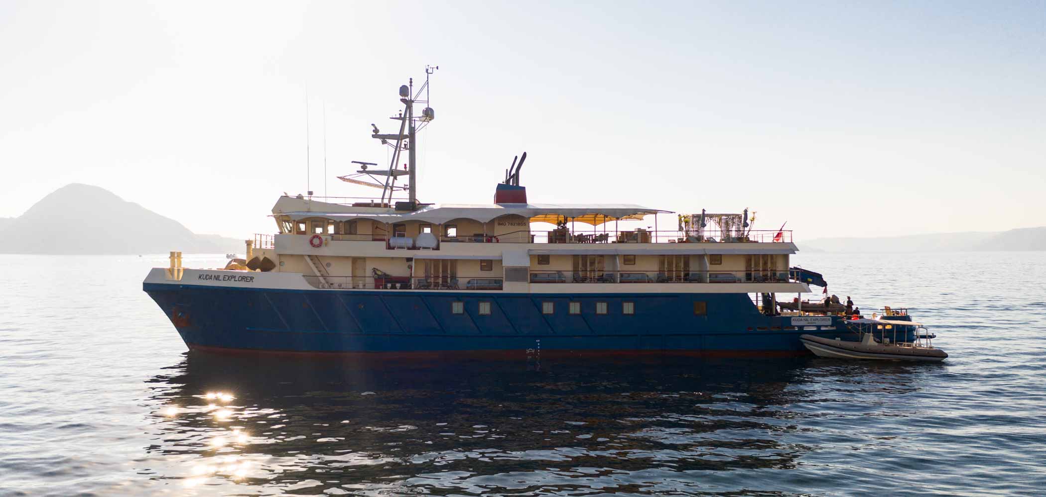 Side view of the Kudanil Explorer superyacht from a yacht charter