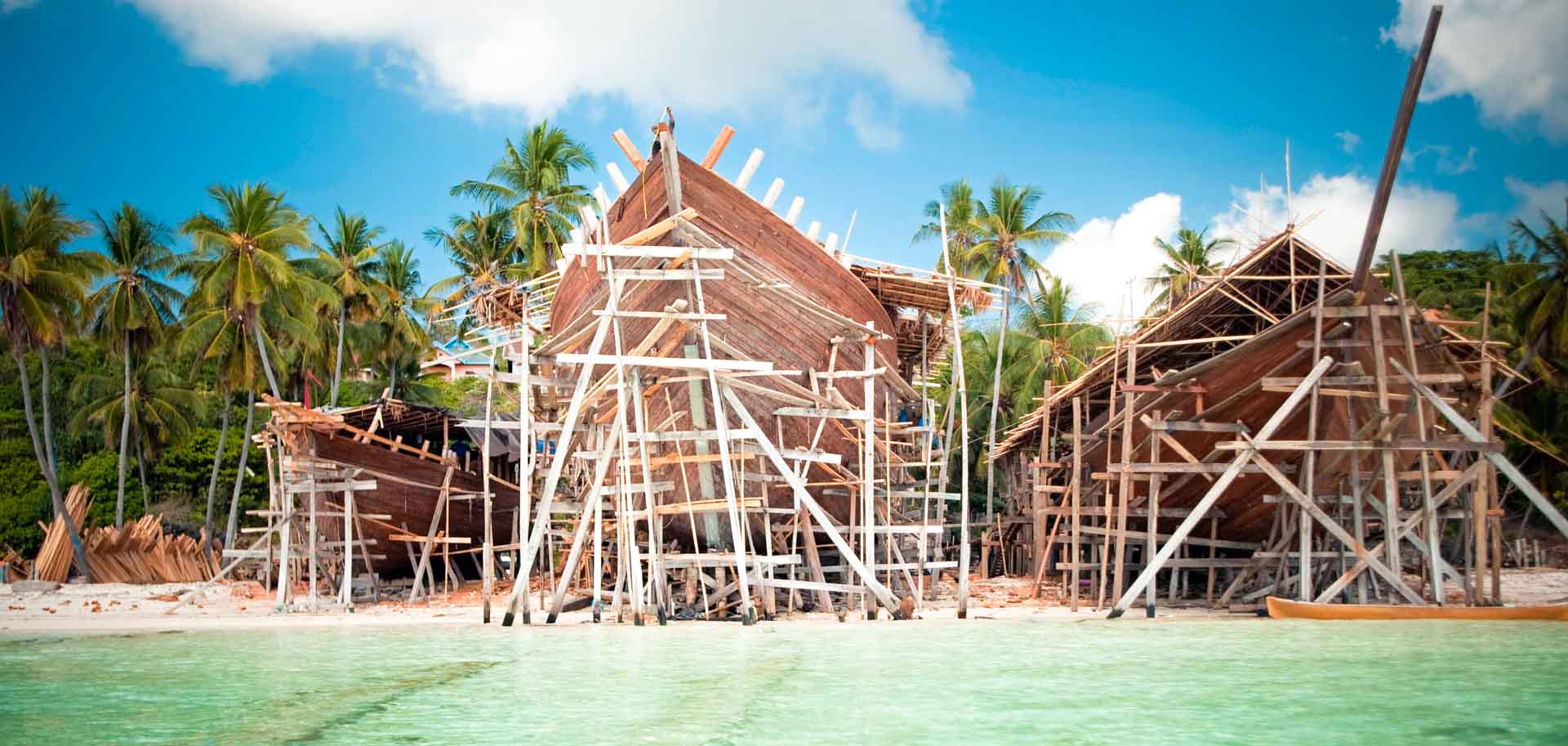 Charter superyacht Lamima being built in the style of traditional wooden Indonesian phinisi boat
